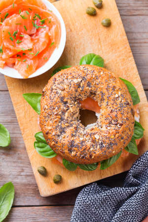 Bagels with cream cheese and salmon. Plating, fast lunch, meal.の写真素材