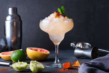Frozen Mezcal or mescal Paloma cocktail with grilled grapefruitの写真素材