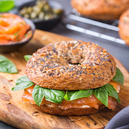 Bagels with cream cheese and salmon. Plating, fast lunch, meal.の写真素材