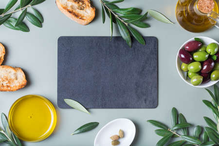 Extra virgin olive oil on a tableの写真素材