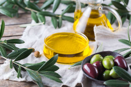 Extra virgin olive oil on a tableの写真素材