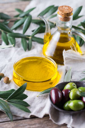 Extra virgin olive oil on a tableの写真素材