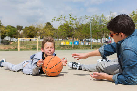 Stylish young boy, teenager with father, outdoors