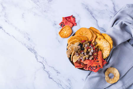 Dried fruits, dehydrated persimmon, watermelon, pineapple, apple chipsの写真素材