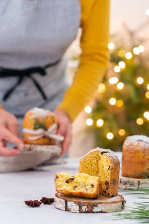 Traditional Italian Christmas cake Panettone with festive decorationsの写真素材