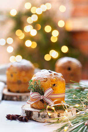 Traditional Italian Christmas cake Panettone with festive decorationsの写真素材