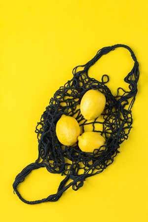 Mesh bag with lemons. Zero waste, plastic free conceptの写真素材