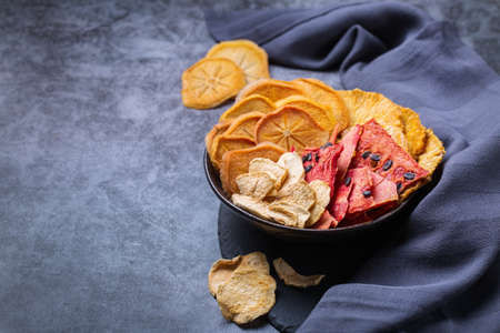 Dried fruits, dehydrated persimmon, watermelon, pineapple, apple chipsの写真素材