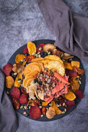 Dried fruits and vegetables, dehydrated persimmon, watermelon, pineapple, beetroot chipsの写真素材