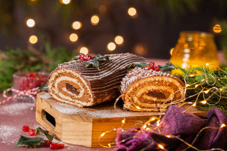 Traditional Christmas cake, chocolate Yule log with festive decorationsの写真素材