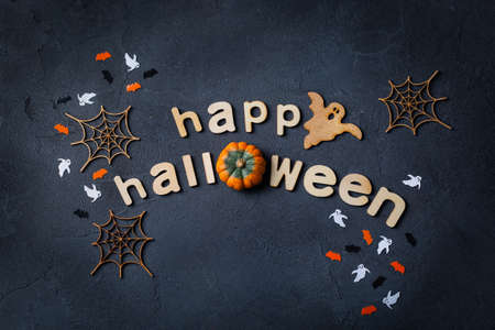 Halloween greeting card with ghosts, spiderweb, pumpkin and batsの写真素材