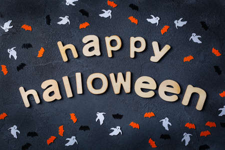 Halloween greeting card with ghosts, spiderweb, pumpkin and batsの写真素材