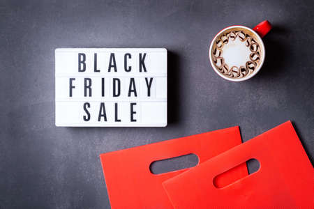 Black Friday Sale pattern with red boxes and shopping bagsの写真素材