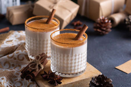 Traditional Christmas drink and dessert Eggnog with handmade gift boxesの写真素材