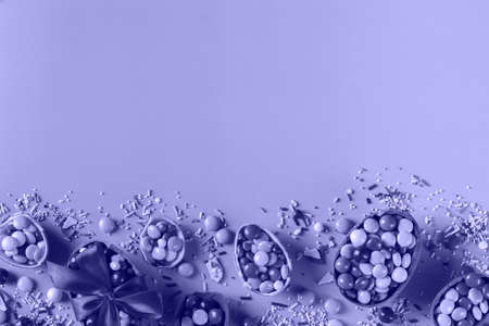 Festive Easter background with chocolate eggs and sweetsの写真素材