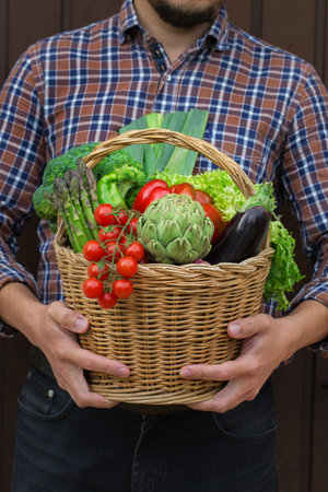 Assortment or farmer market bio organic ripe vegetables in handsの写真素材