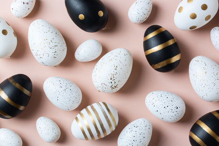 Happy Easter greeting card with eggs on pink backgroundの写真素材