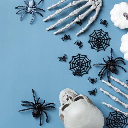 Halloween greeting card with pumpkin, skulls, bony hands and leavesの写真素材