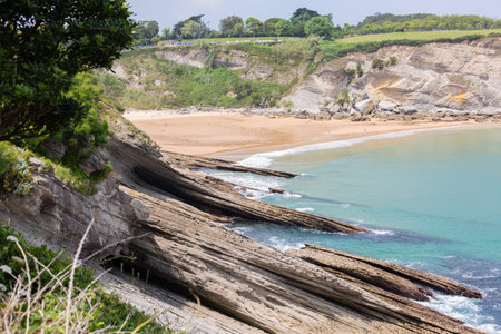 Rocky coastline and Playa de Matalenas beach near Santander, Cantabria