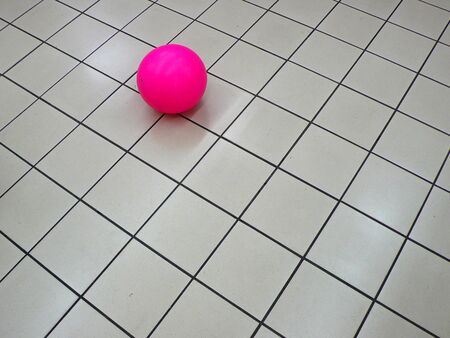 pink ball on the floor ,white tileの写真素材