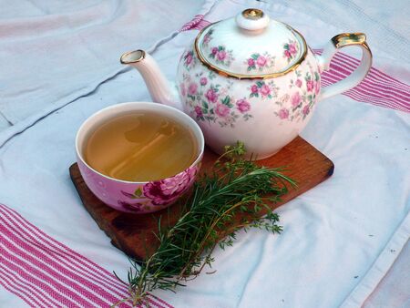 herb tea, bowl and teapot on table, interiorの写真素材