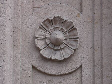 embossed concrete floxer on a door, in Franceの写真素材