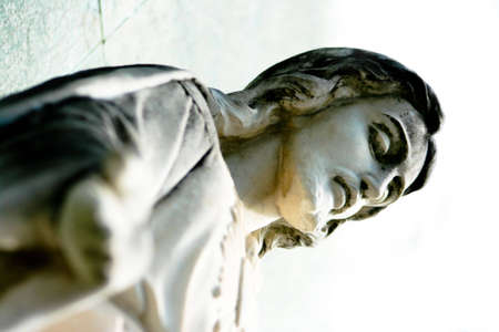 Stone Statue of Jesus Christ in a Cemeteryの写真素材