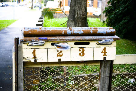 Letterbox with mail and numbers 1, 2, 3, 4