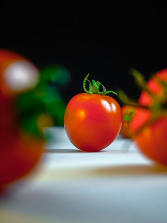 Tomatoes on the kitchen table. Shallow depth of field.の写真素材