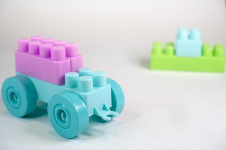 Plastic toy car on a white background. Toy for children.
