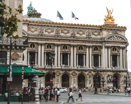 Paris, France-JULY 19, 2014: View on the Opera National de Paris and street with cafe. Grand Opera Opera Garnier is famous neo-baroque building in Paris.のeditorial素材