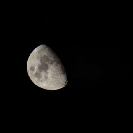Half moon at night in the deep sky.