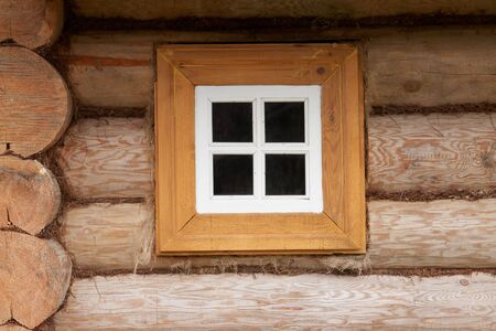  Small window of rural wood house                                の写真素材