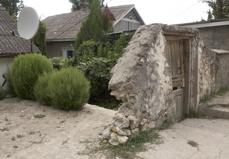 Ancient street with satellite antenna on roof  in Bakhchisaray,  Crimea    の写真素材