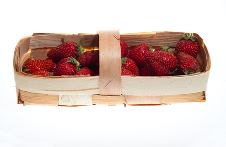 Garden strawberry in wooden basketの写真素材