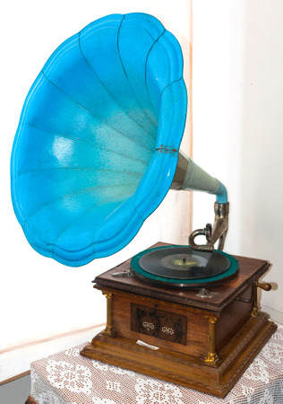 Ancient turquoise gramophone on nightstandの写真素材