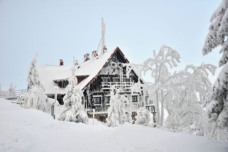 Swieradow Zdroj resort, Poland, December 16, 2018: old house in hoarfrost on frosty winter day,...