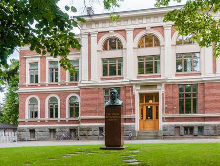 Mixed school (formed Real Lyceum) and bust of Eino Sakari Yrj?-Koskinen in Pyynikki Church Park, Tampere, Finlandのeditorial素材