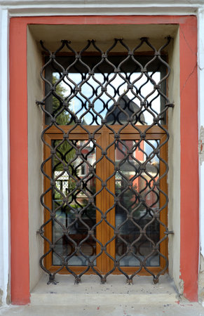 Reflection in window with lattice of Church of St. Sergius of Radonezh (1694) of Cathedral of St. Peter, Vysokopetrovsky Monastery male monastery on Petrovka street, in center area of Moscow, Russiの写真素材