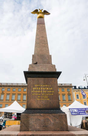 Helsinki, Finland, August 09, 2014: Eagle-topped granite monument called "Obelisk of the Empress" (Fin. Keisarinnankivi) on Kauppatori Square Gift to Helsinki unveiled with Nicholas I and Alexandriaのeditorial素材