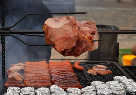 Outdoor grilling meat and sausagesの写真素材