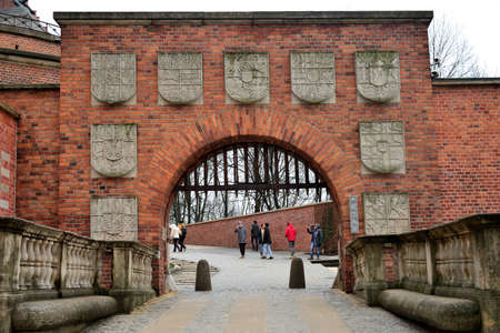Krakow, Poland, December 23, 2018: entrance to Wawel Royal Castle from Kanonichi Street through Armorial Gateのeditorial素材