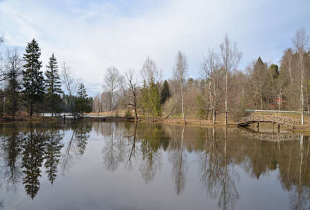 Abramtsevo, near town of Sergiev Posad, Moscow region, Russia, April 24, 2018: Lower pond with wooden bridges in spring park, Abramtsevo Museumのeditorial素材