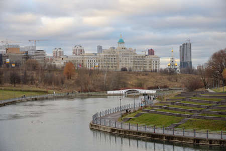 Moscow, Russia, November 16, 2021: Pond of Olympic Village Park and Michurinsky Prospect in autumnのeditorial素材