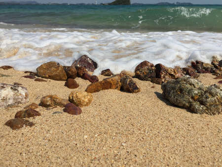 Stones and rocks on the sand beach in Thailand. Beautiful of the beach and the sea water at Samed...