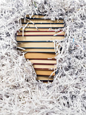 stack of books between paper stripsの写真素材