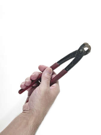 Hand of man holding a pincerの写真素材