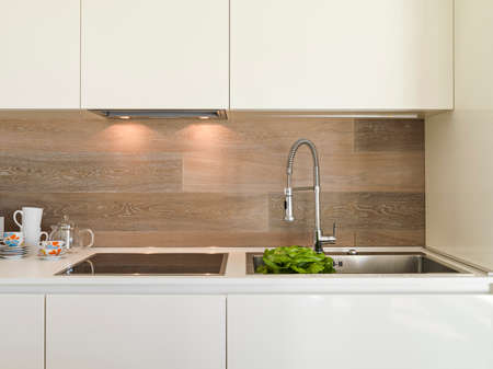detail of steel faucet in a modern kitchenの写真素材
