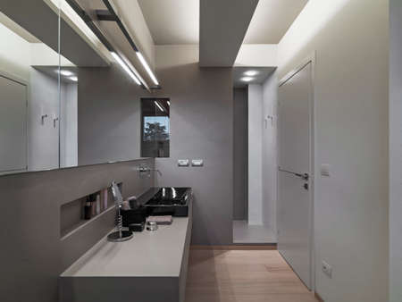 interior view of a modern bathroom, in the foreground the vanity basinの写真素材