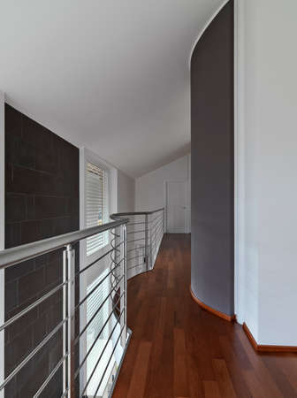 interior view of a loft with wooden flooring and steel banistersの写真素材
